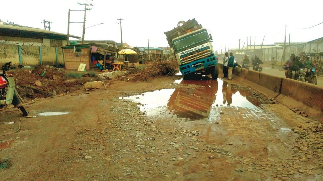 Truck stuck where a road has collapsed